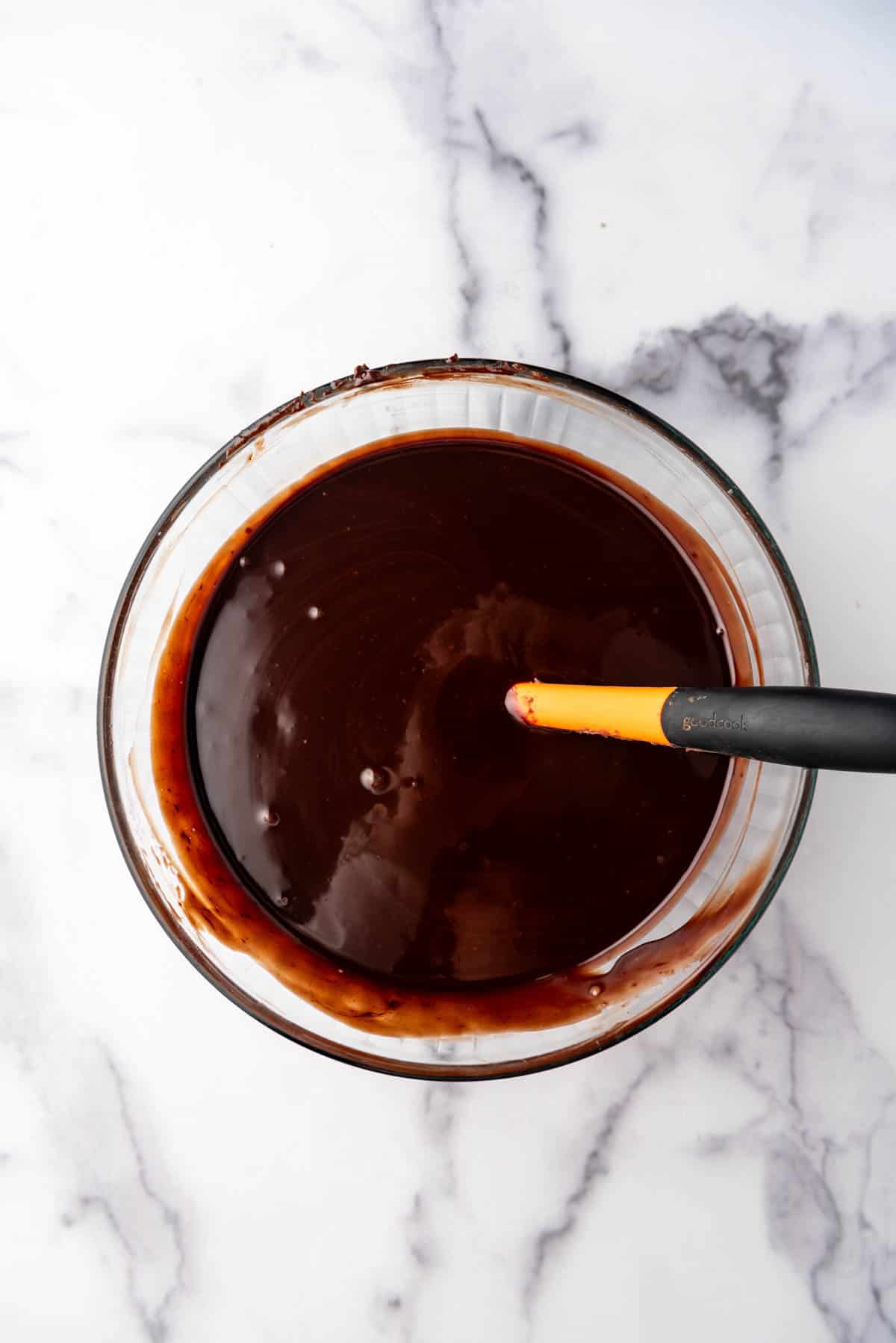 Chocolate ganache in a large mixing bowl.