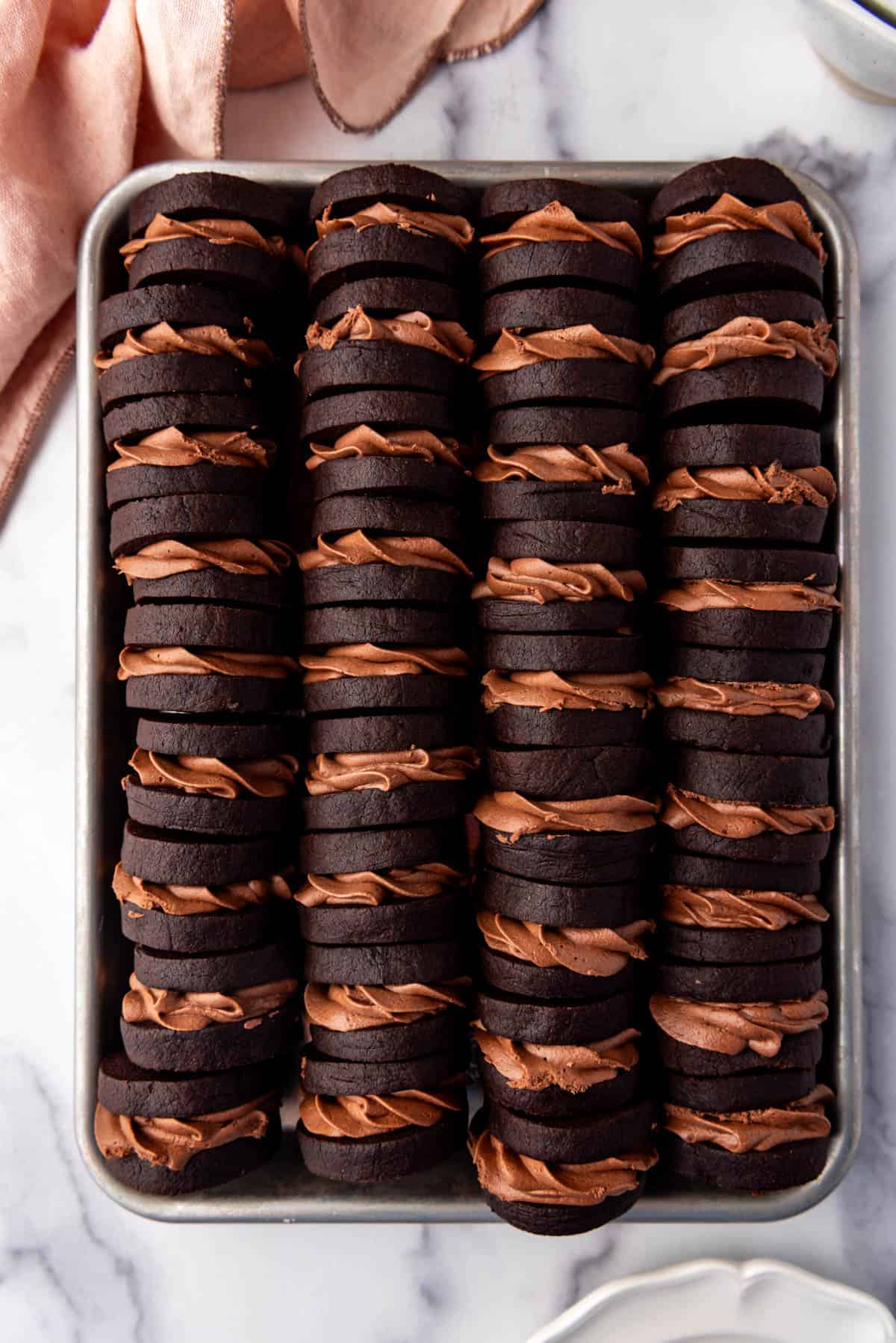 A large tray of chocolate nutella sandwich cookies.