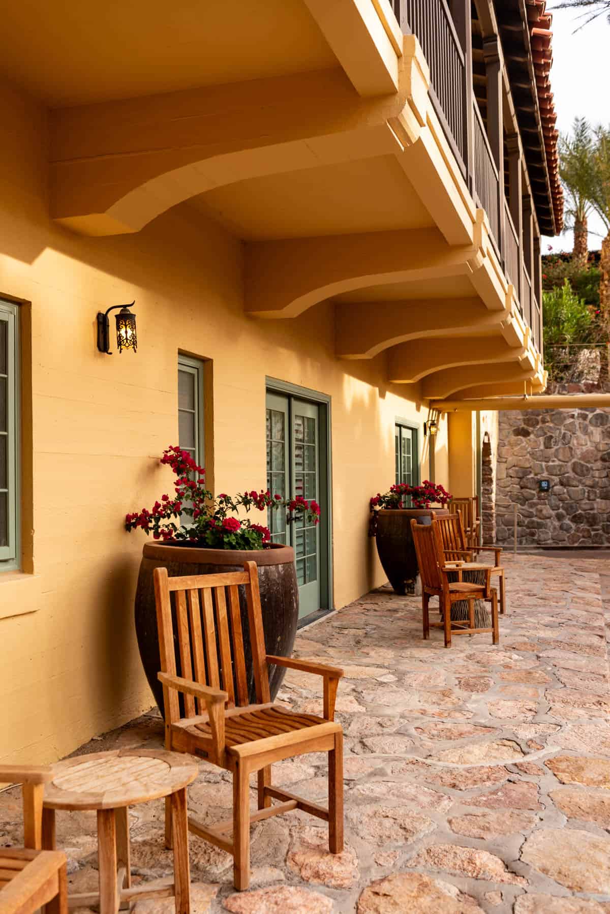 Chairs in front of the rooms on the patio at the Oasis at Death Valley.