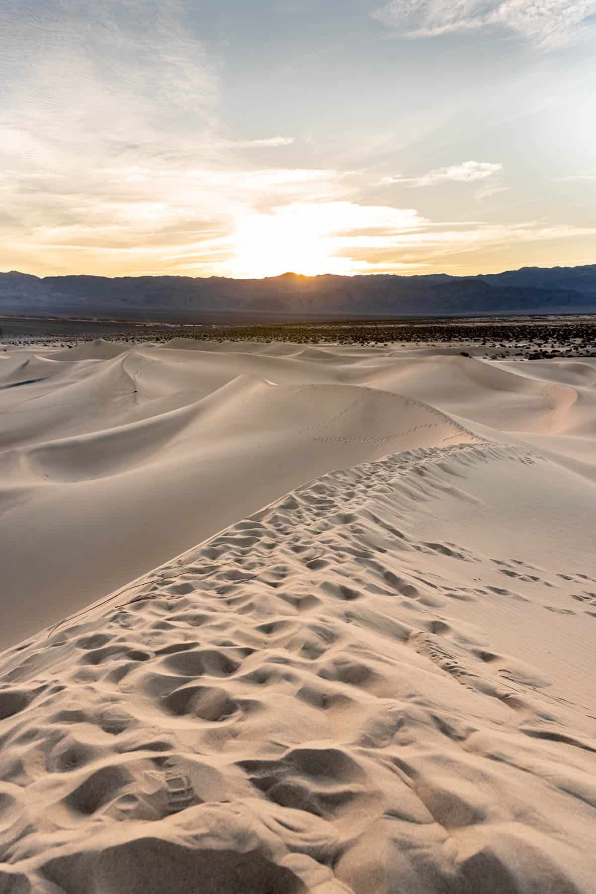 An image of sunset over the sand dunes in Death Valley.