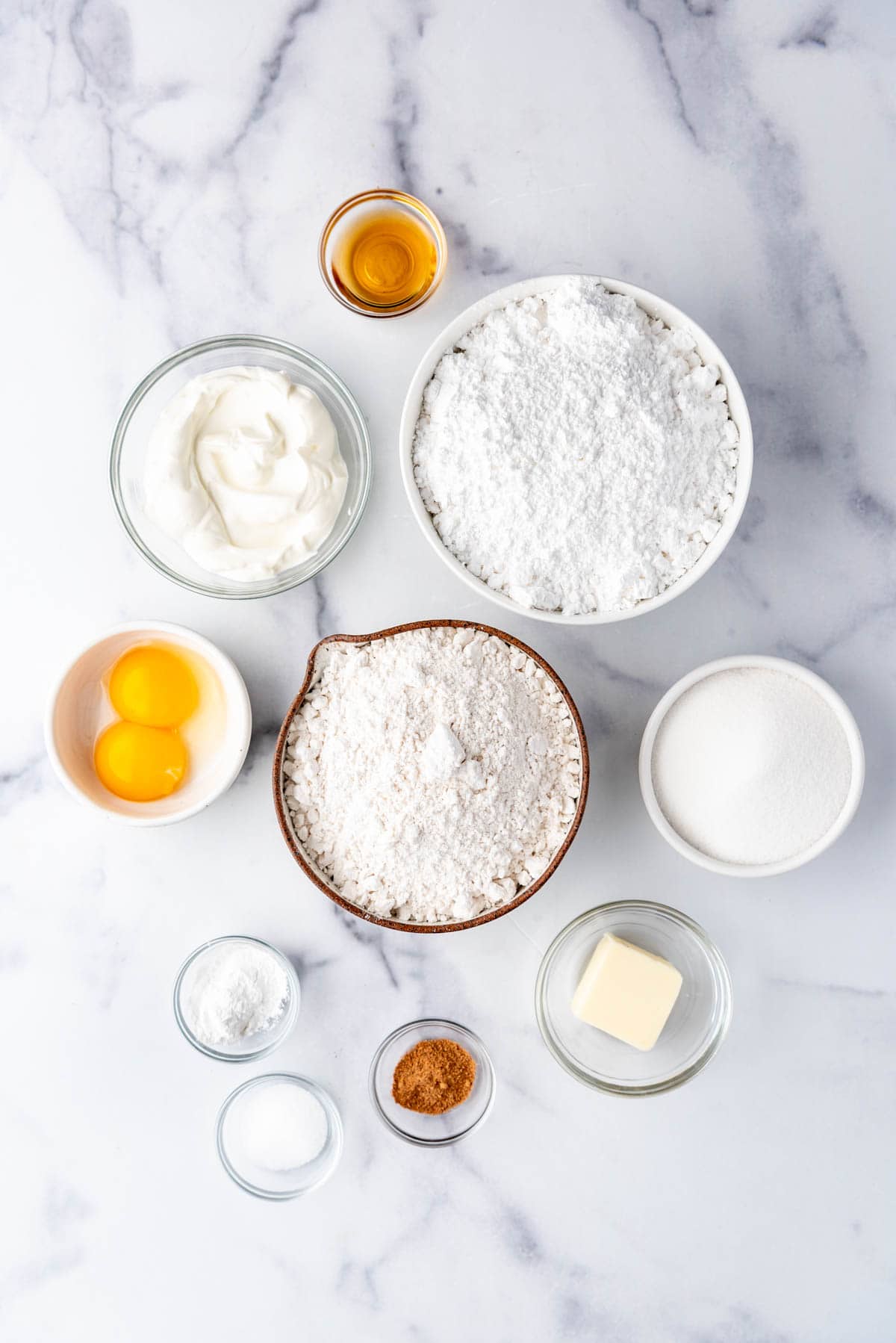 Ingredients for homemade sour cream doughnuts.