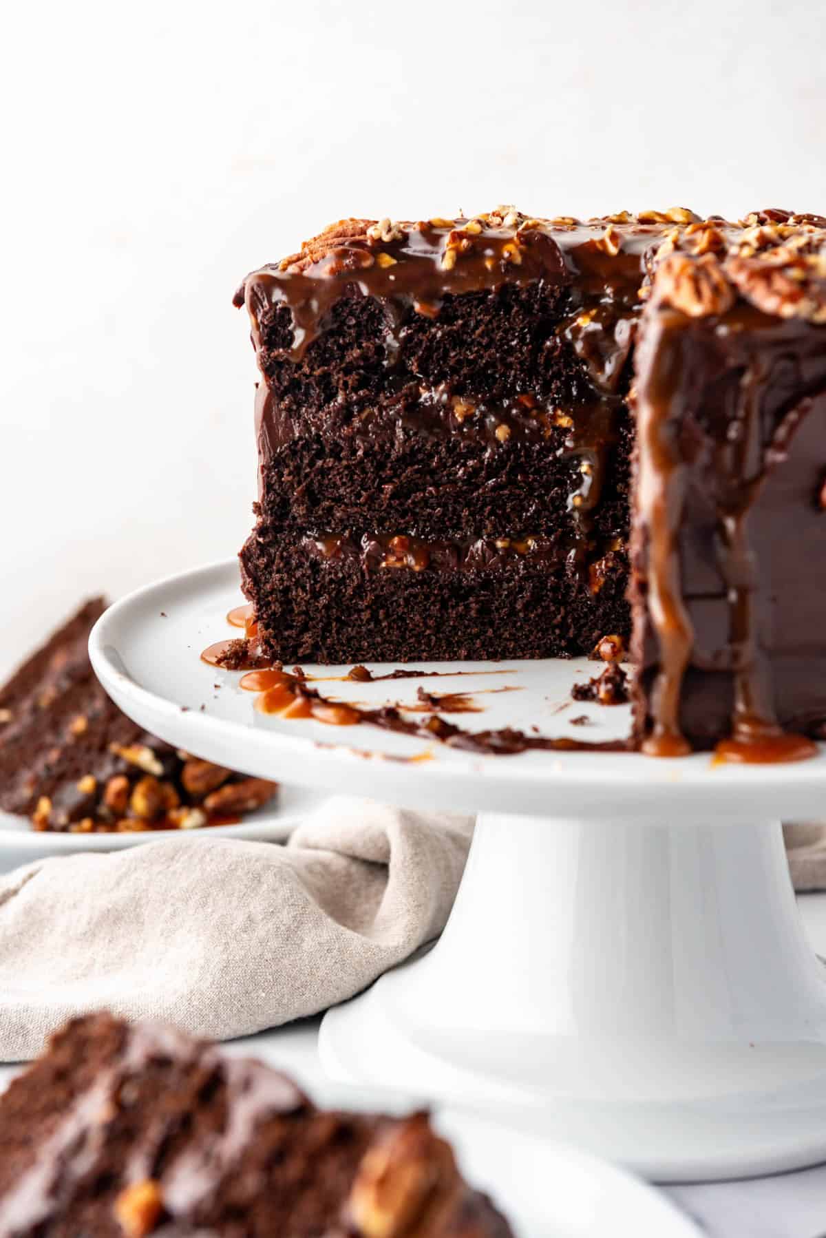 A cross-section of a chocolate caramel turtle cake.