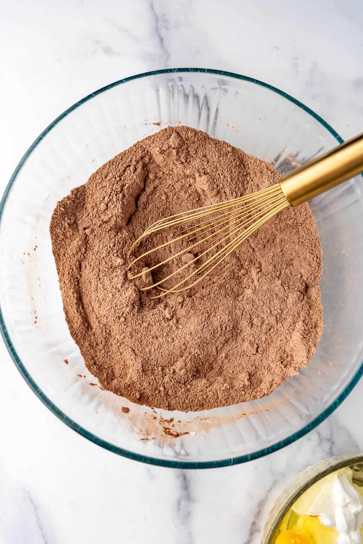 Dried ingredients whisked together in a bowl.