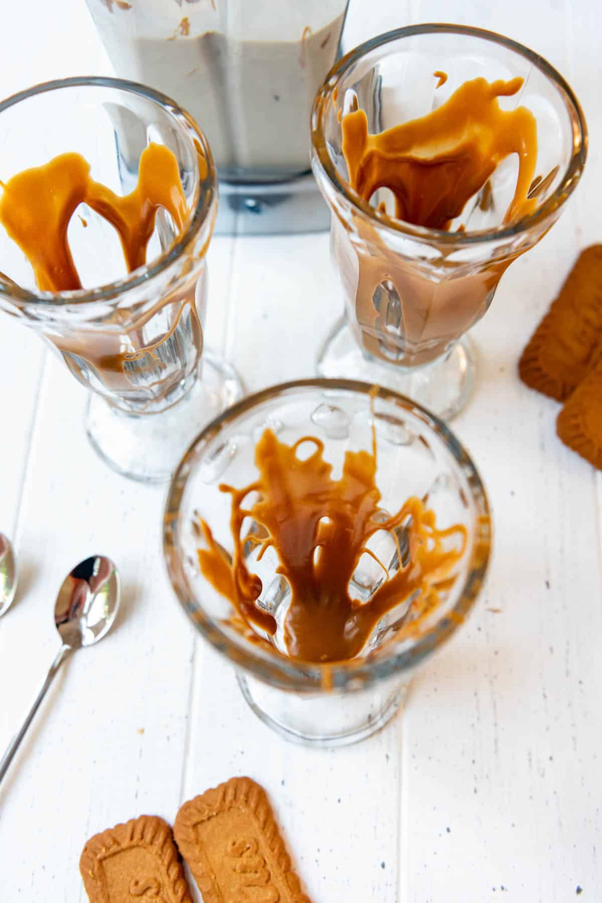 Melted cookie butter drizzled around the outside edges of a tall glass.