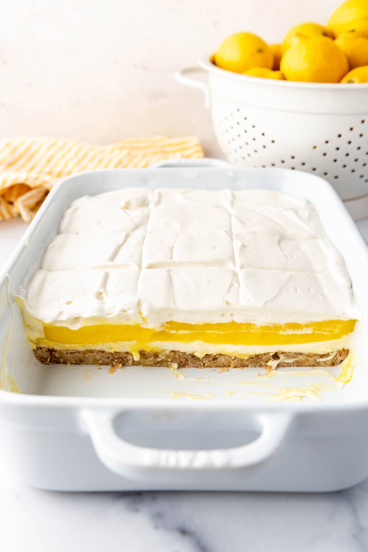 An image of sliced lemon lush in a baking dish.