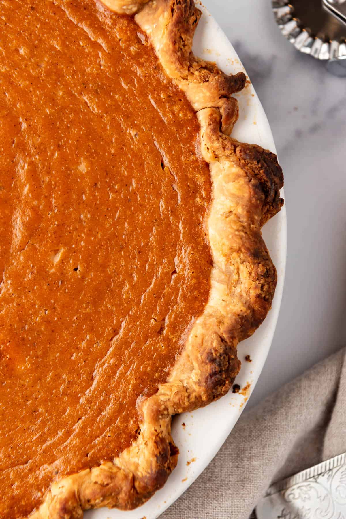 A close up view of the top of a sweet potato pie.