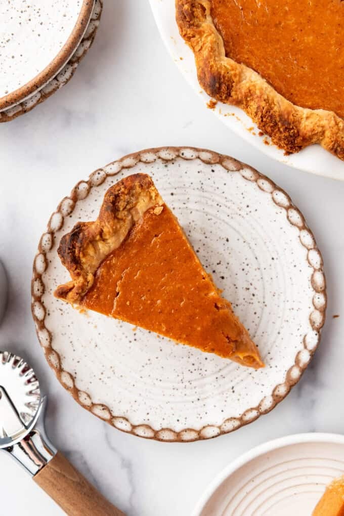 A slice of pie on a plate.