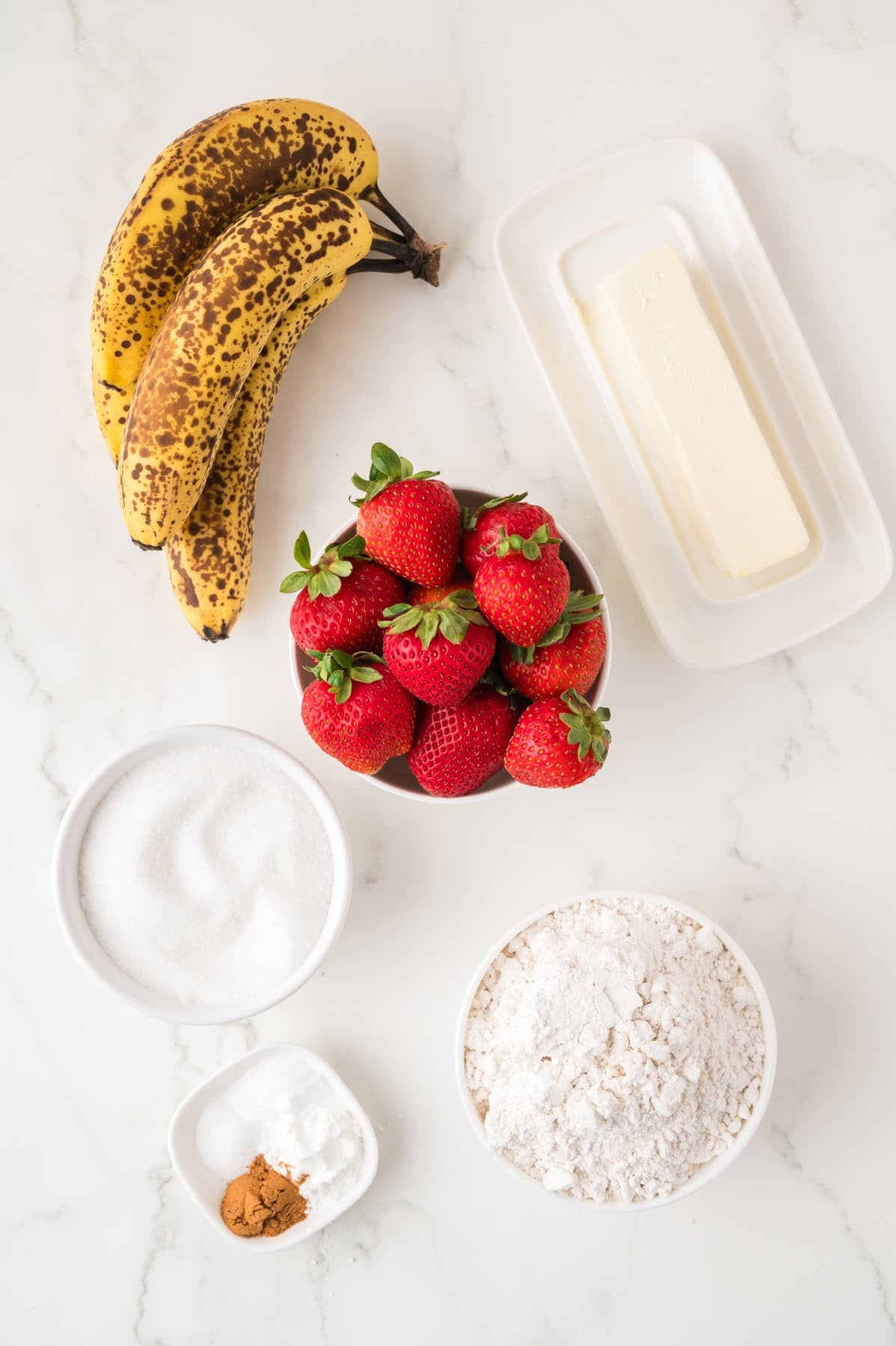 Ingredients for making strawberry banana bread.