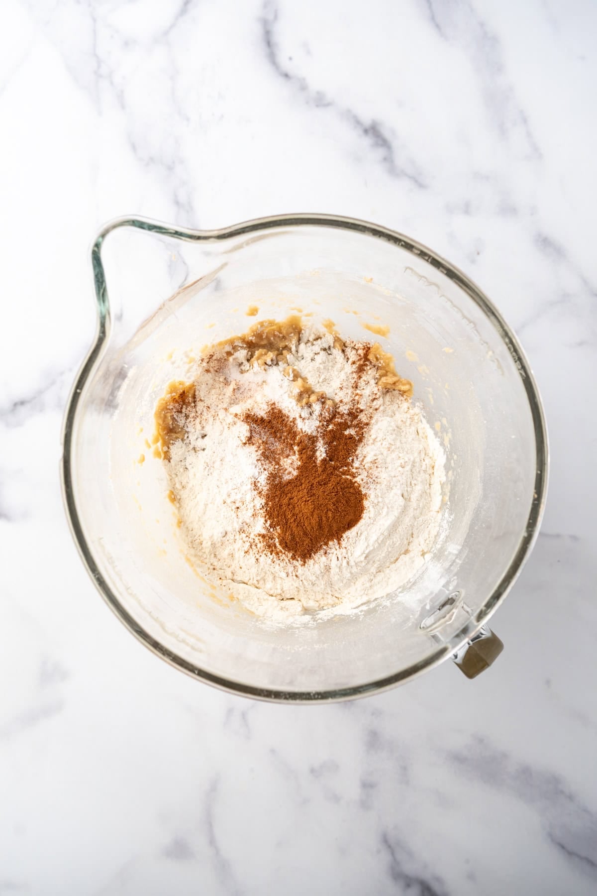 Adding dry ingredients to churro cookie dough.
