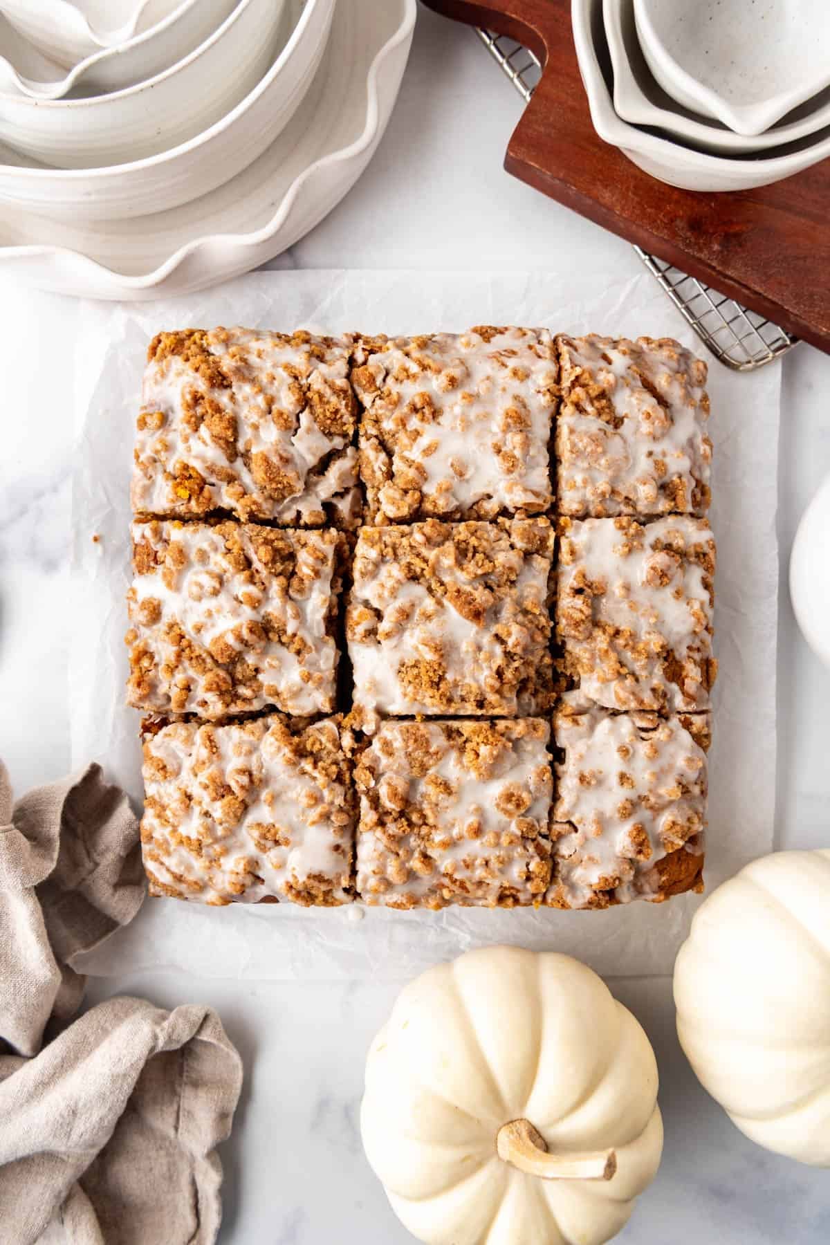 An overhead image of glazed pumpkin coffee cake.