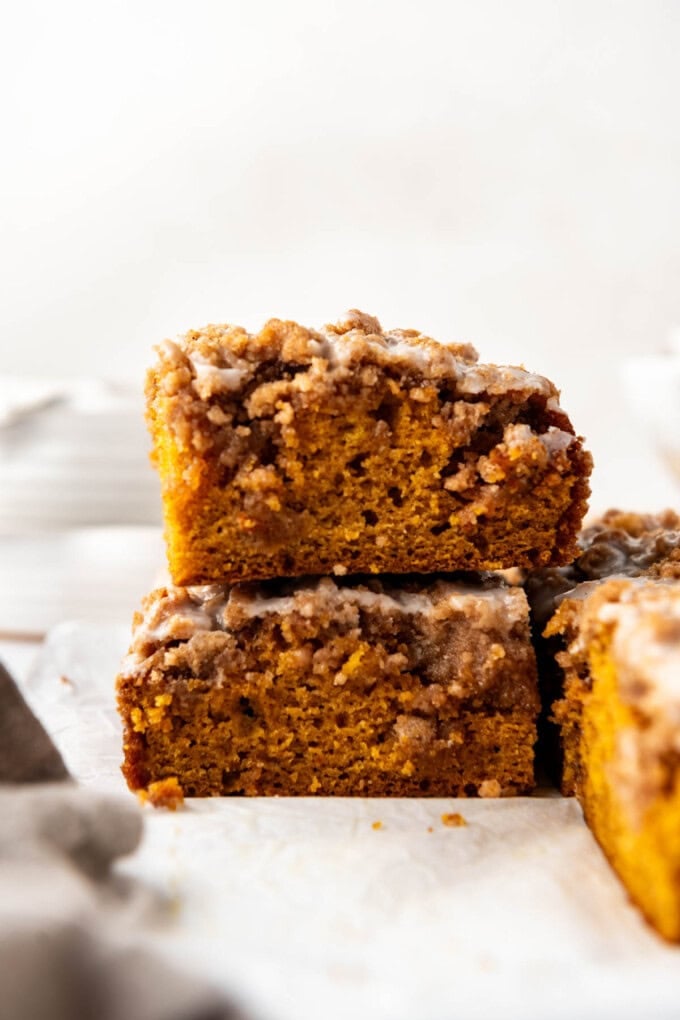 Stacked pieces of pumpkin coffee cake.