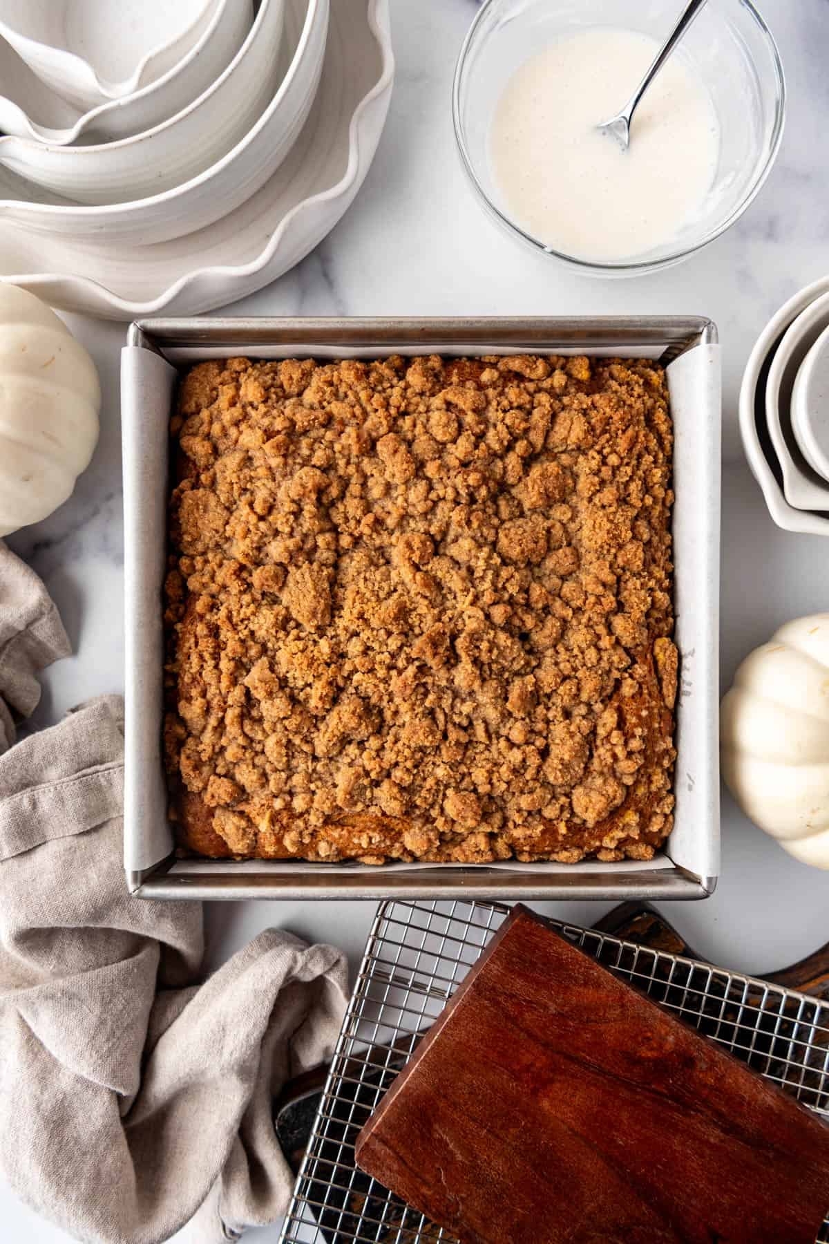Baked pumpkin coffee cake with streusel topping.