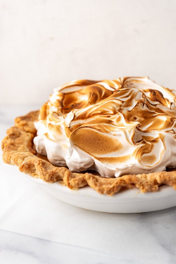 An image of a sweet potato pie topped with toasted marshmallow meringue.