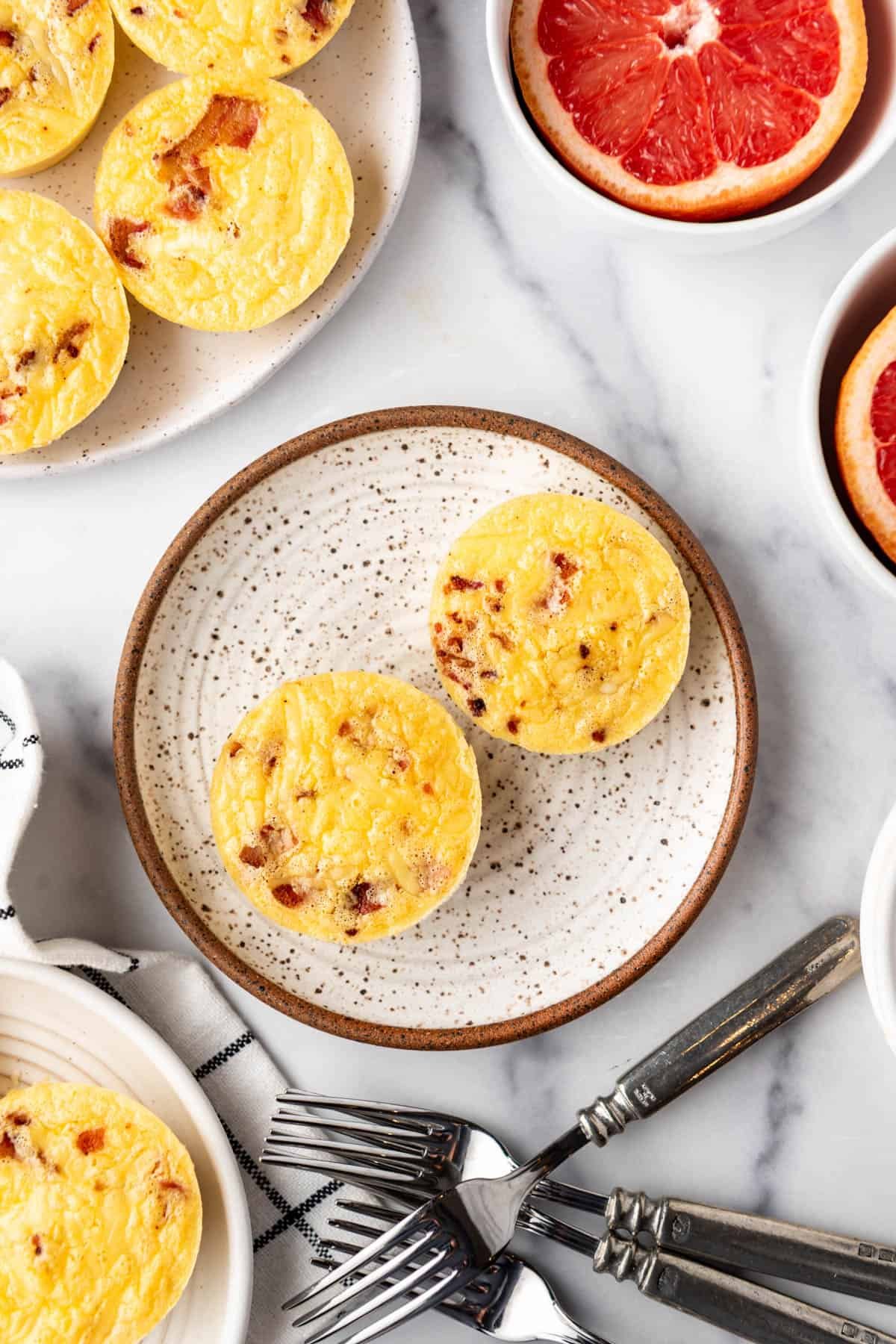 An overhead image of two egg bites on a plate.