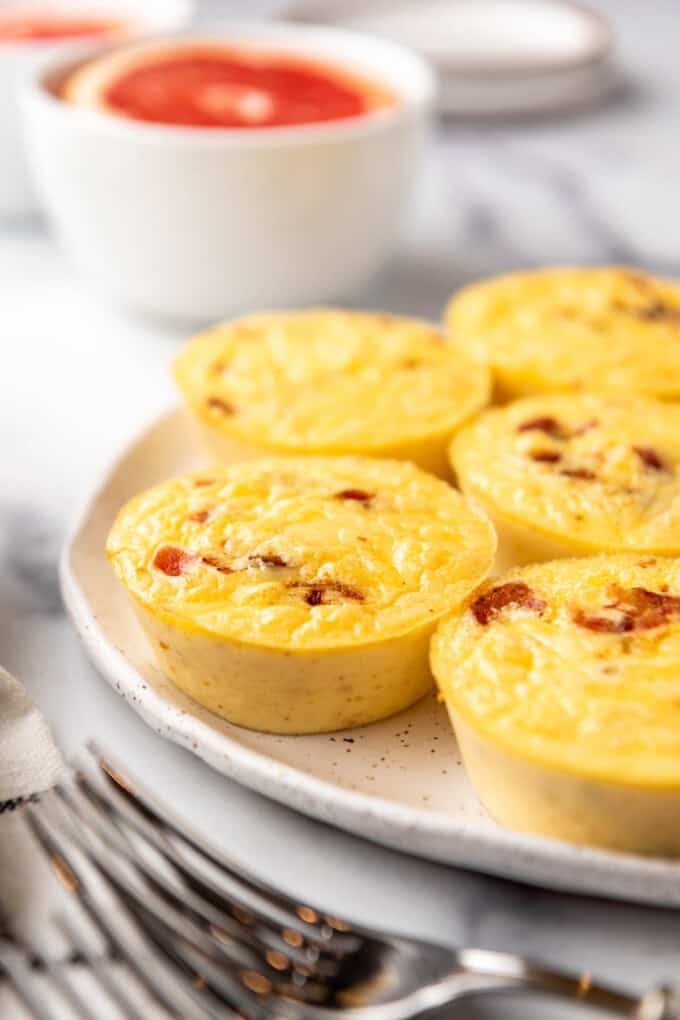 Finished copycat starbucks bacon gouda egg bites on a plate.