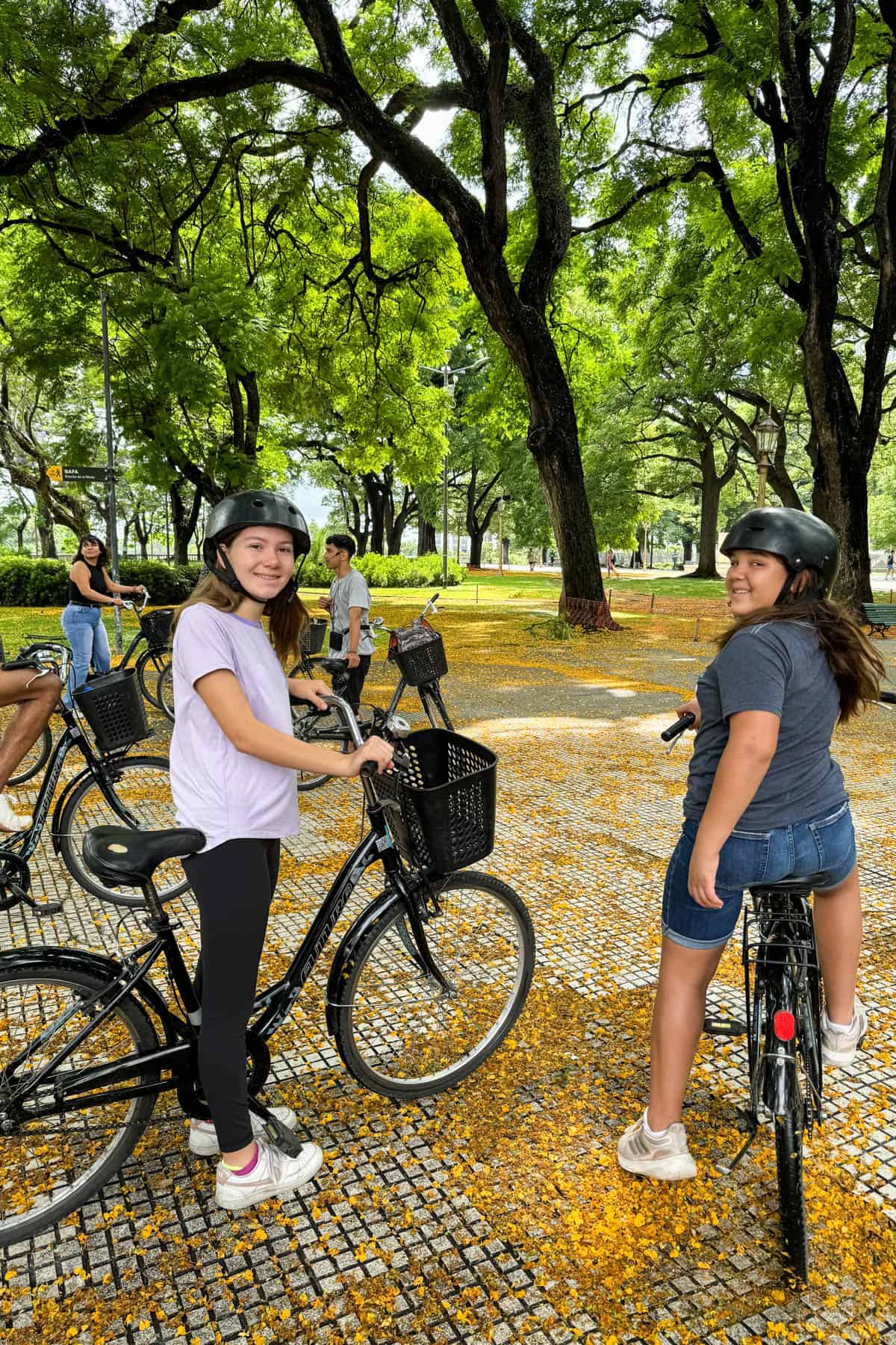 Kids on bikes in a park in Buenos Aires.