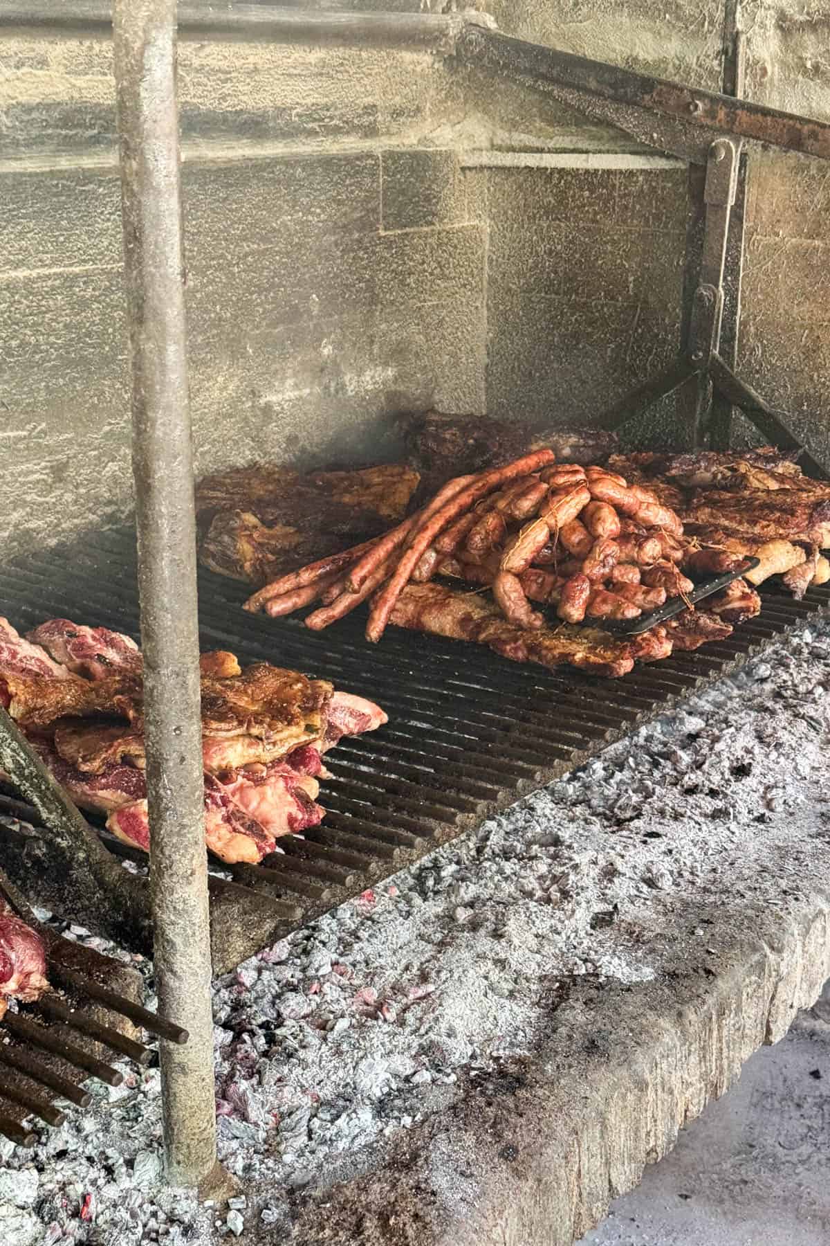 More meat being grilled over charcoal in Argentina.