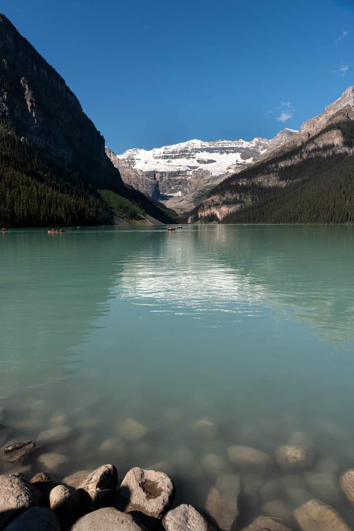 An image of submerged rocks at Lake Louise in Banff National Park.