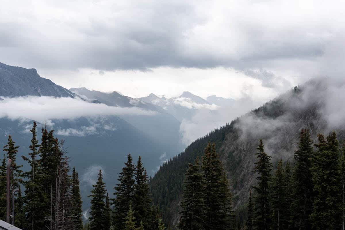 A view of cloudy mountains in Banff, Canada.