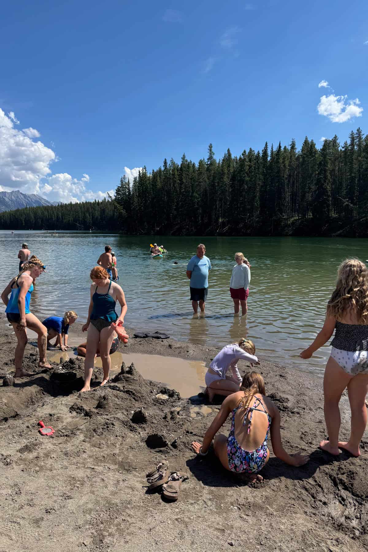 Kids playing at a lake beach in Canada.