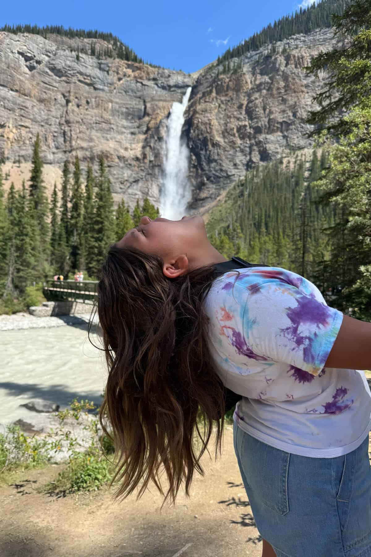 A child "swallowing" a waterfall optical illusion.