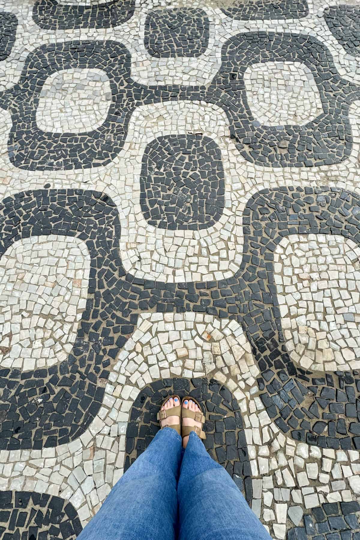 An image of the black and white tiled design of Ipanema Beach in Rio de Janeiro, Brazil.