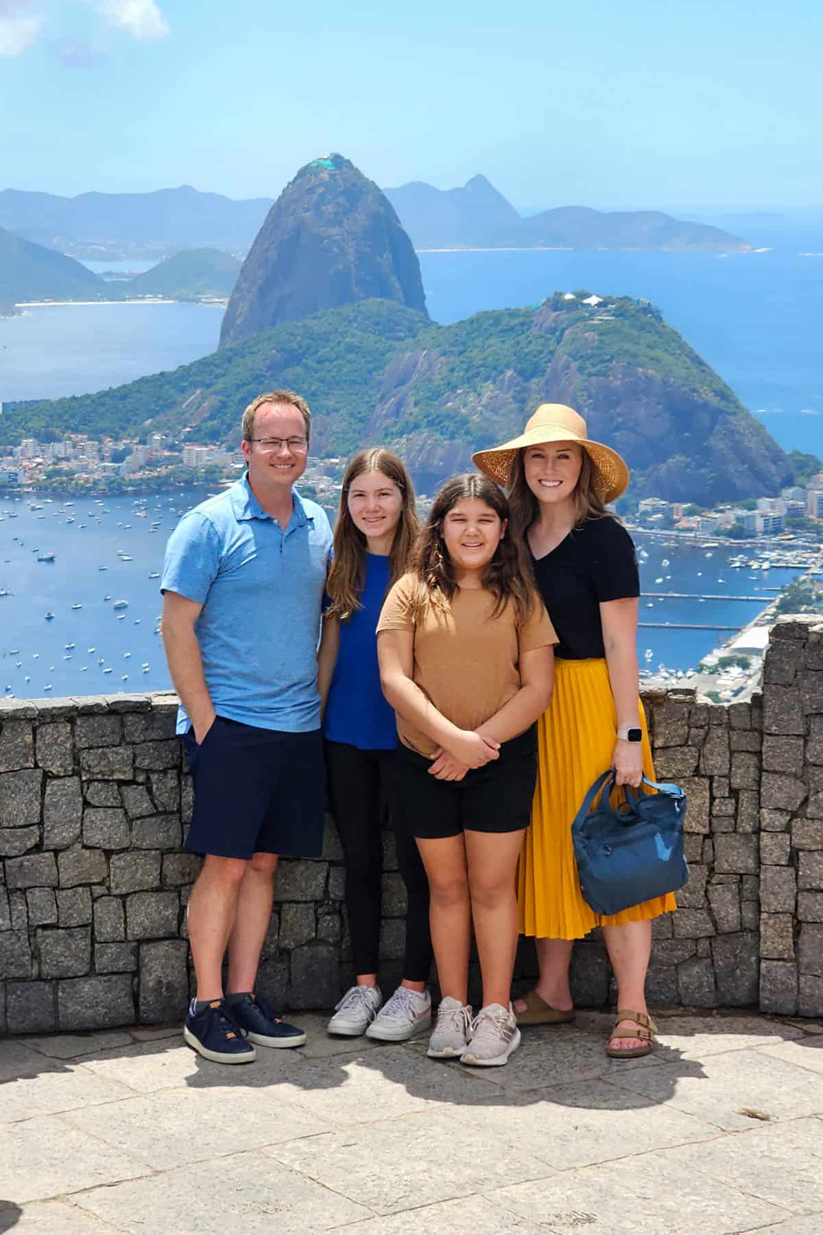 A family in Rio de Janeiro with Sugarloaf Mountain in the background.