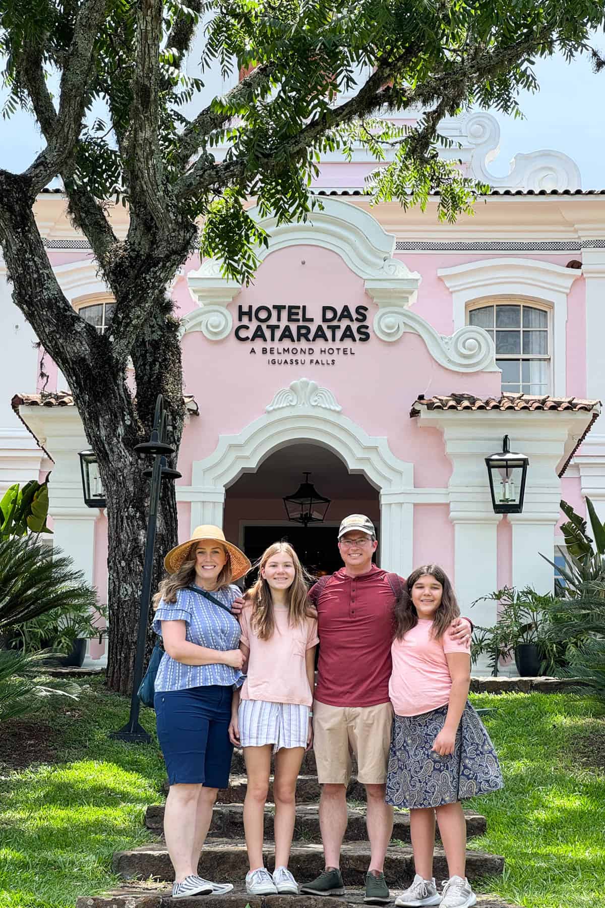 A family in front of the entrance to Hotel das Cataras at Iguazu Falls in Brazil.