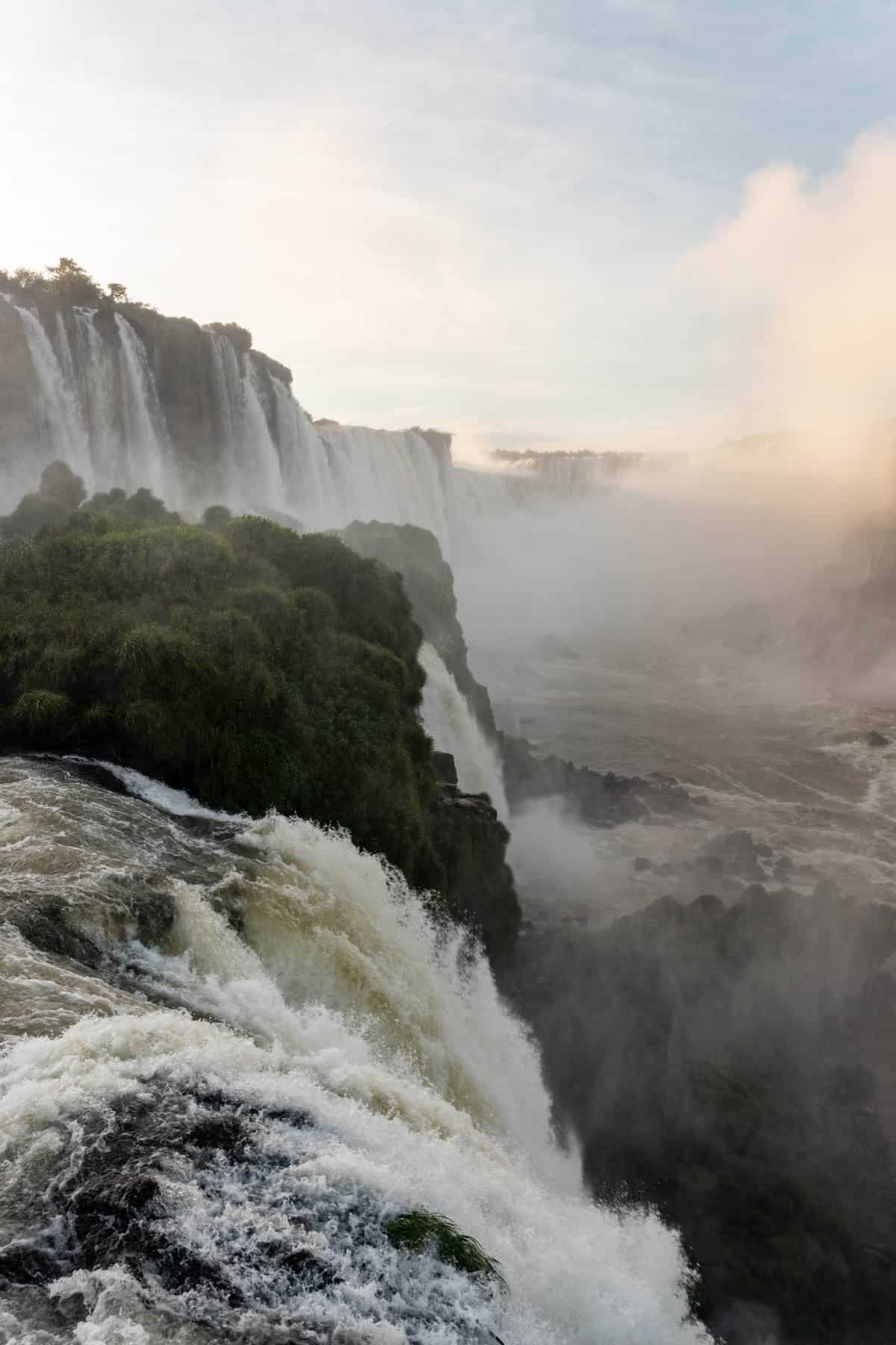 An image of water going over Iguazu Falls on the Brazil side.