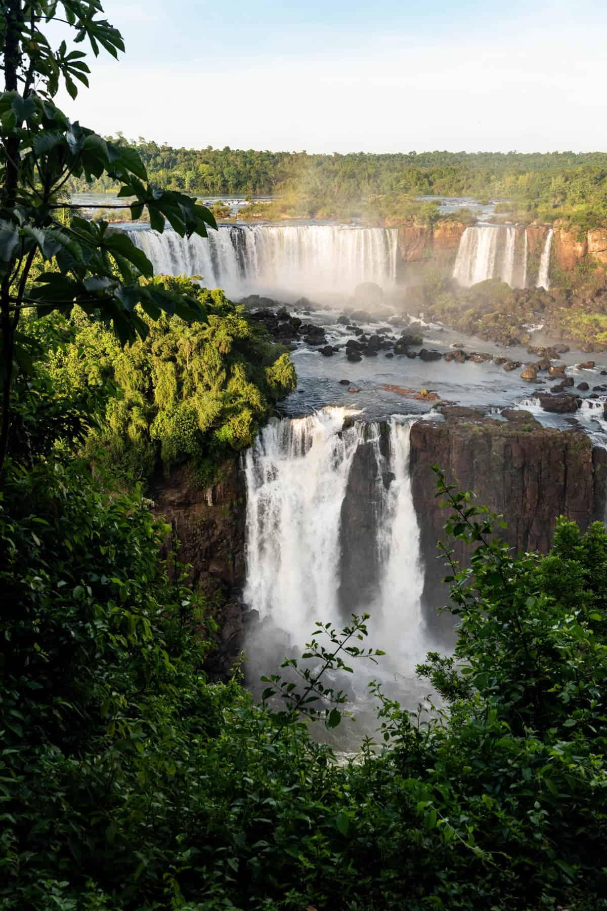 An image of a portion of Iguazu Falls seen from the Brazil side in the early morning hours.