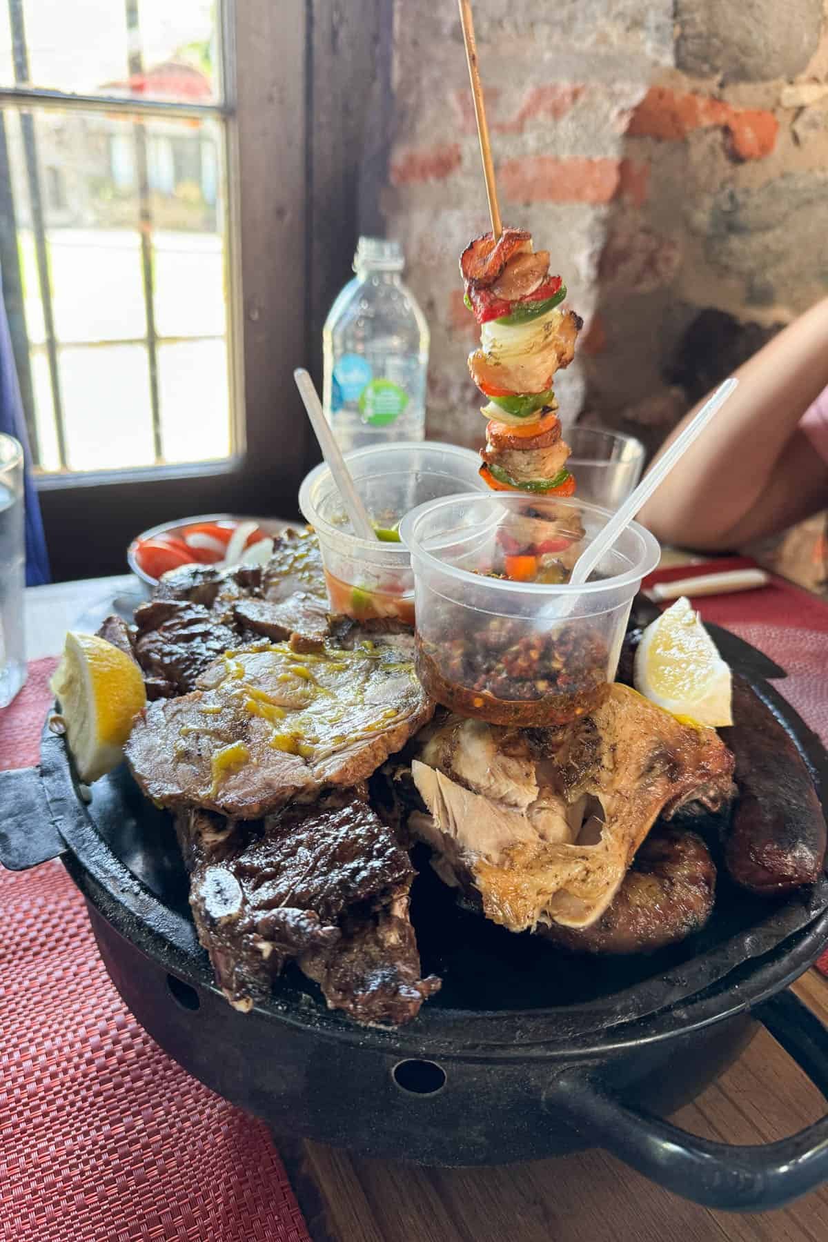 A large charcoal grill of different cuts of meat in Uruguay.