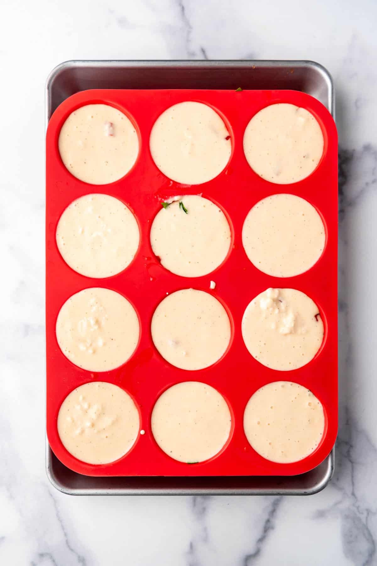 Egg white mixture in silicon muffin cups.