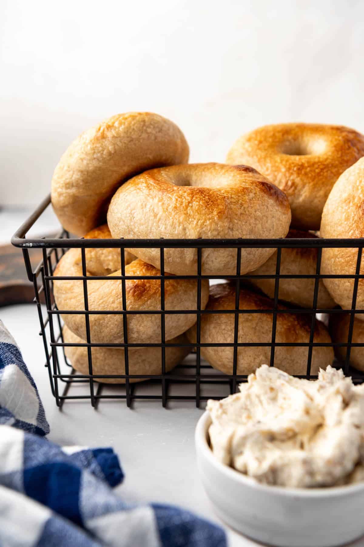 A wire basket of sourdough bagels.