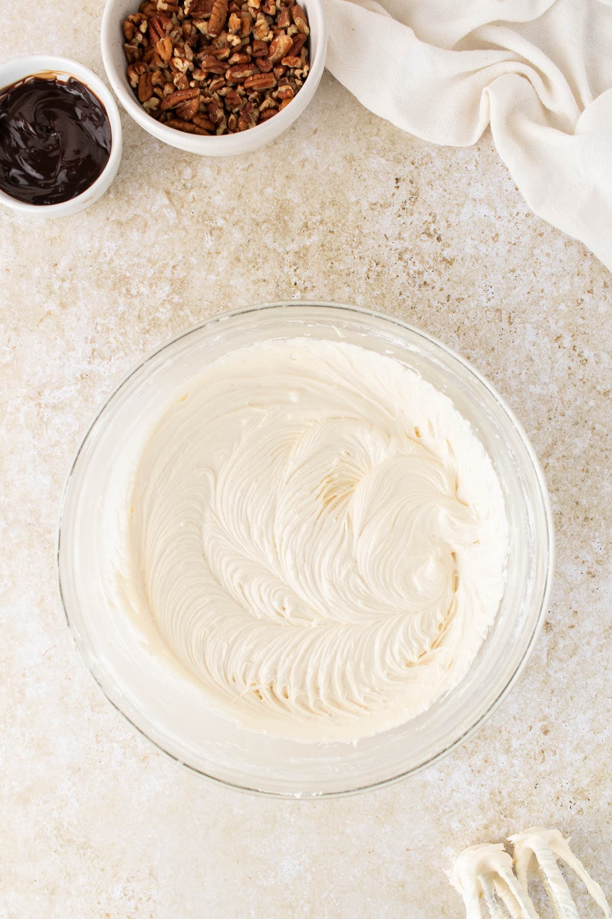A batch of caramel frosting in a bowl.