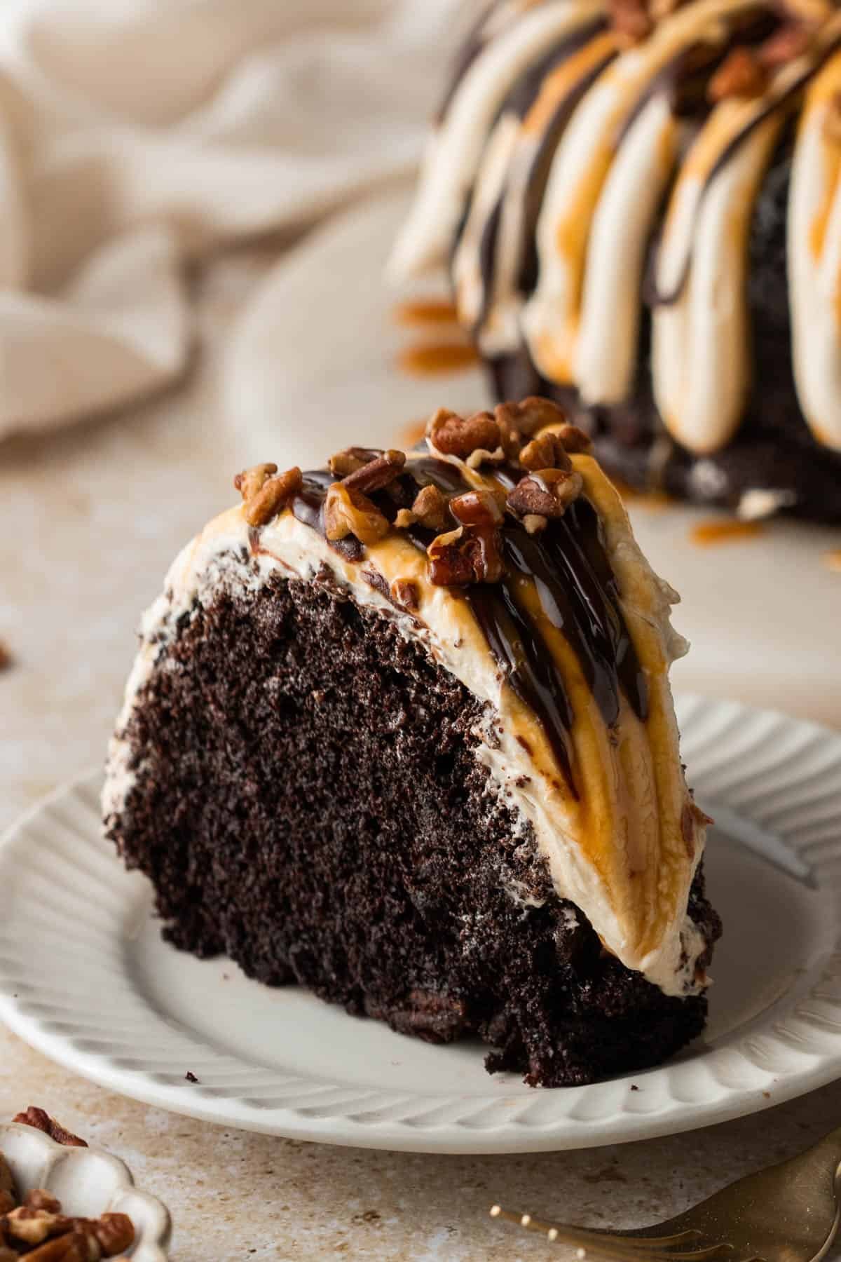 A slice of turtle bundt cake on a plate.