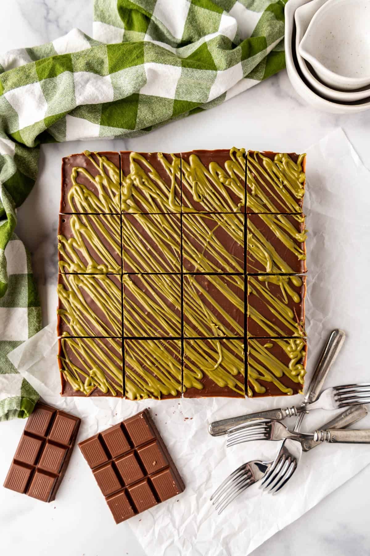 Homemade Dubai chocolate brownies that have been cut into 16 squares.