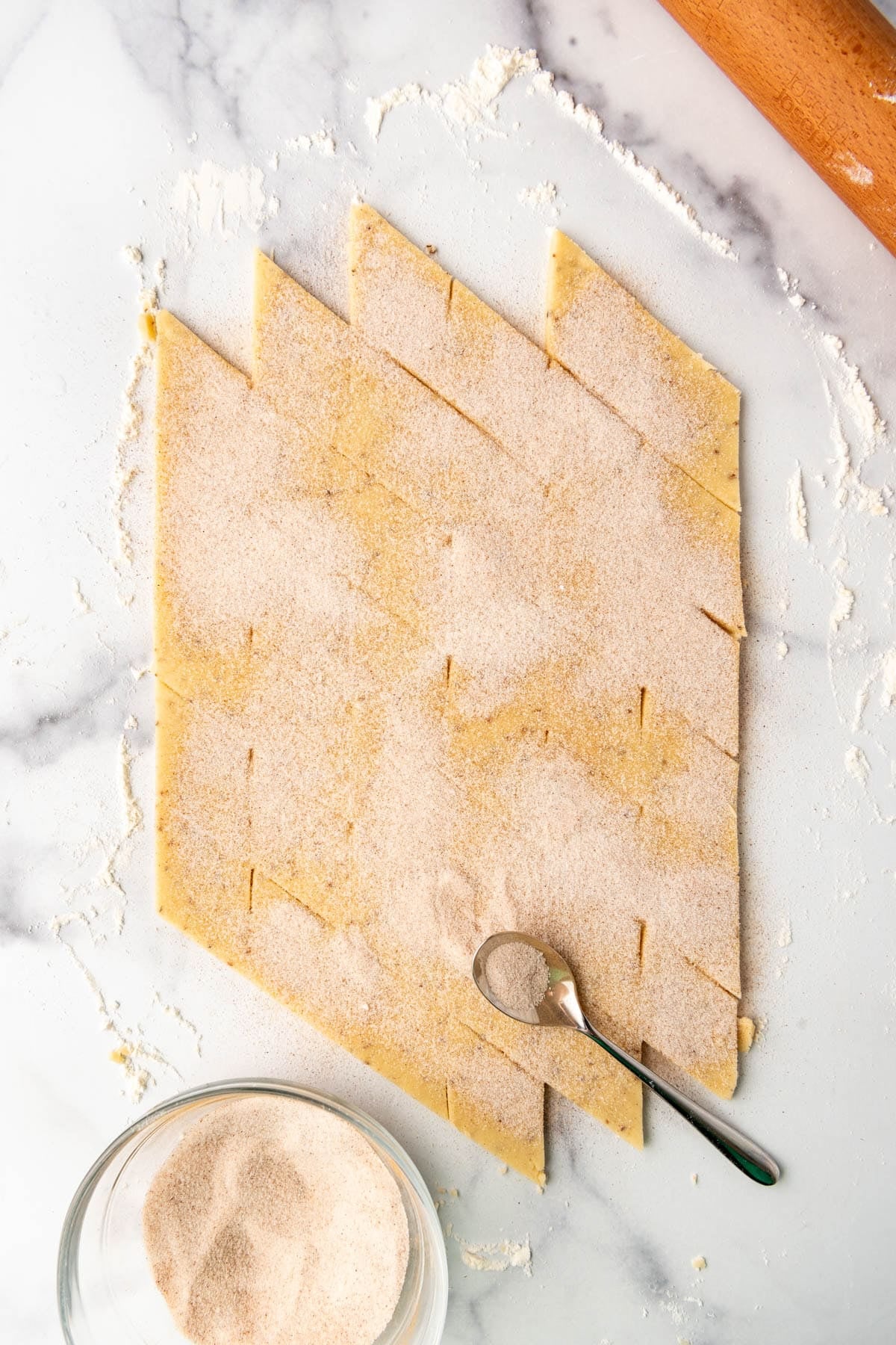 Cinnamon sugar sprinkled over cookie dough before baking.