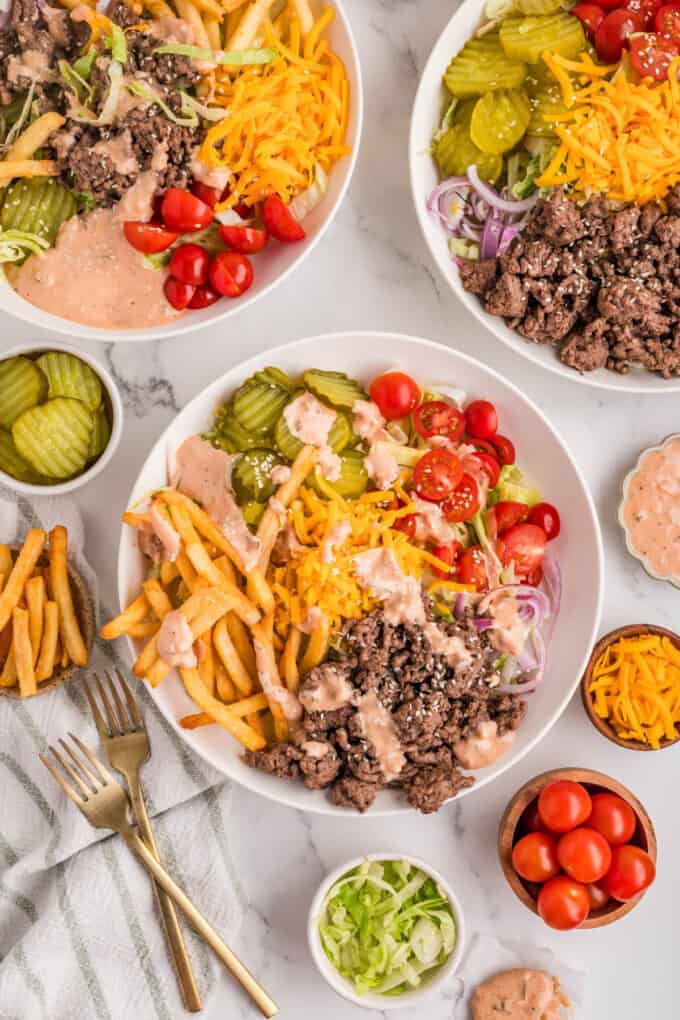 An overhead image of several burger bowls.