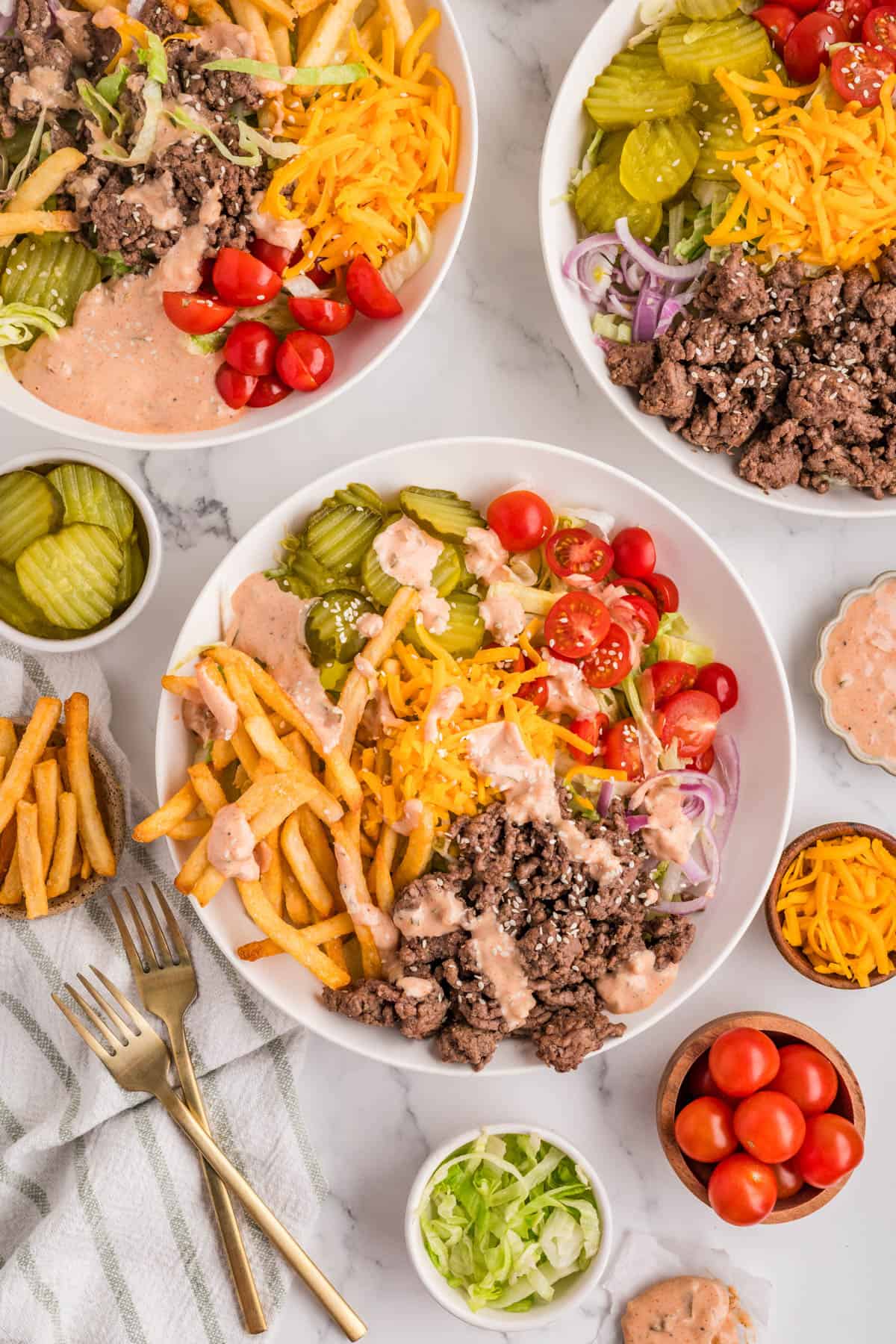 An overhead image of several burger bowls.