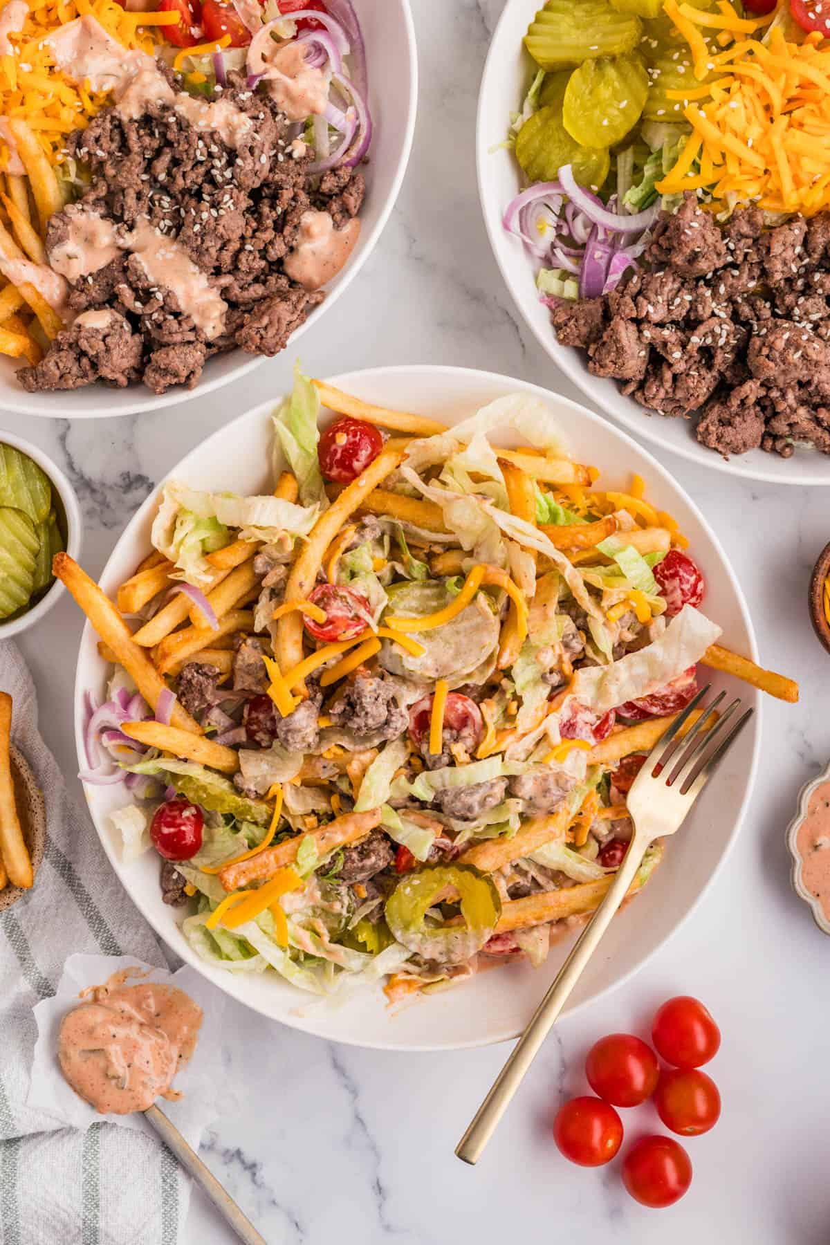 A burger bowl with everything mixed together.