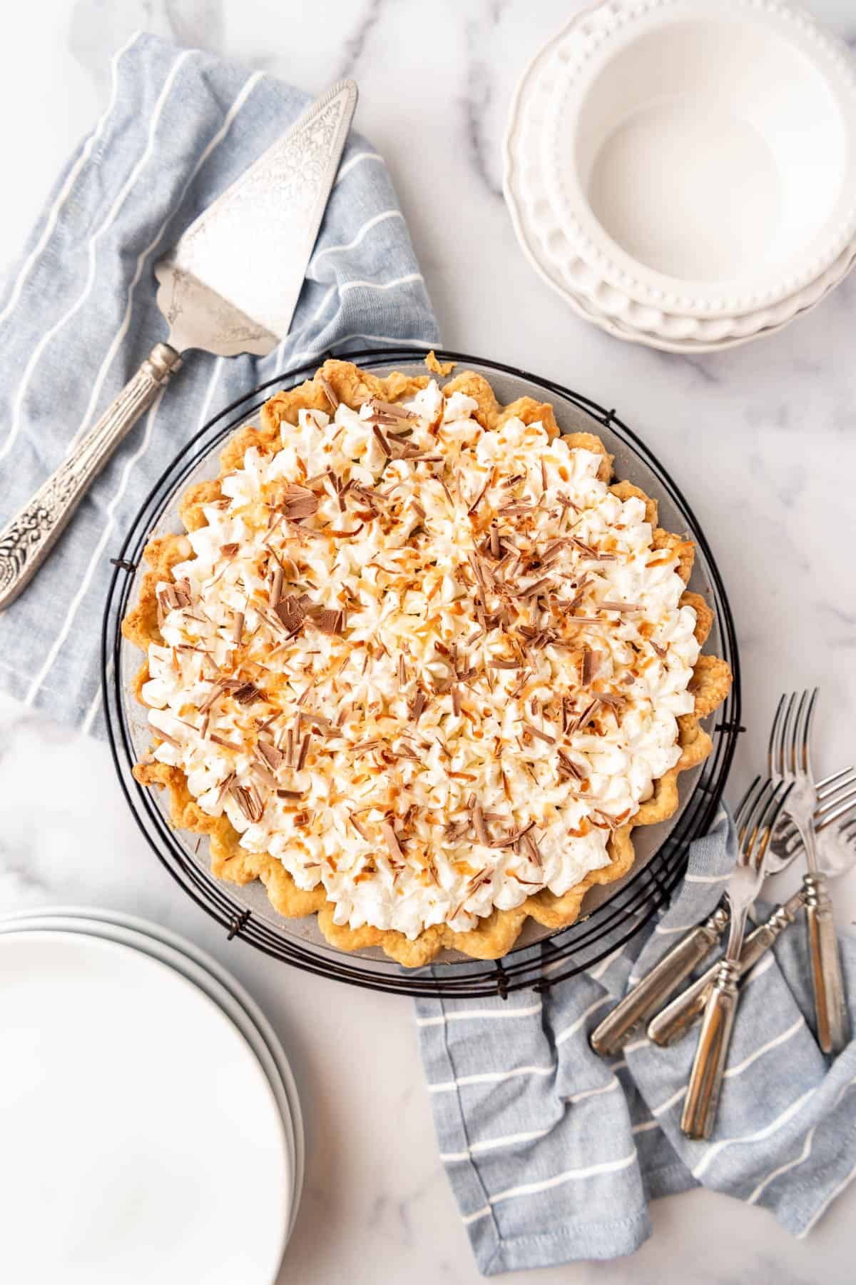 A haupia pie decorated with chocolate shavings and toasted coconut.