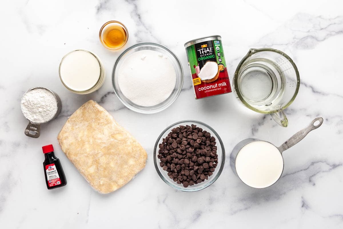 Ingredients for making haupia pie on a white marble surface.