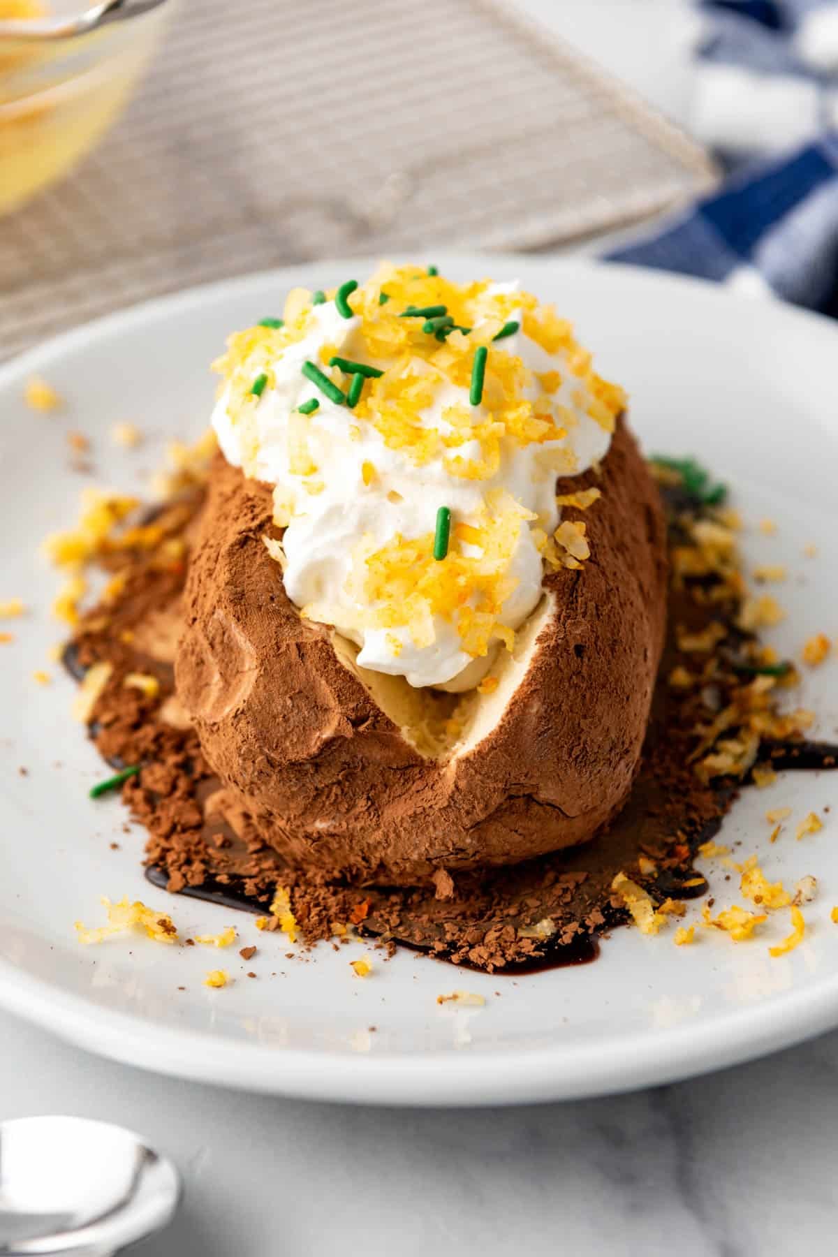 A Westside diner inspired ice cream baked potato on a white plate.