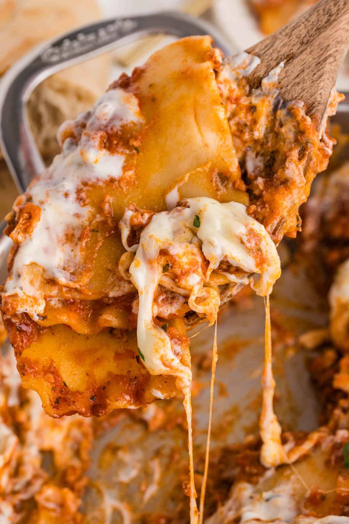 A scoop of skillet lasagna being lifted from the pan.