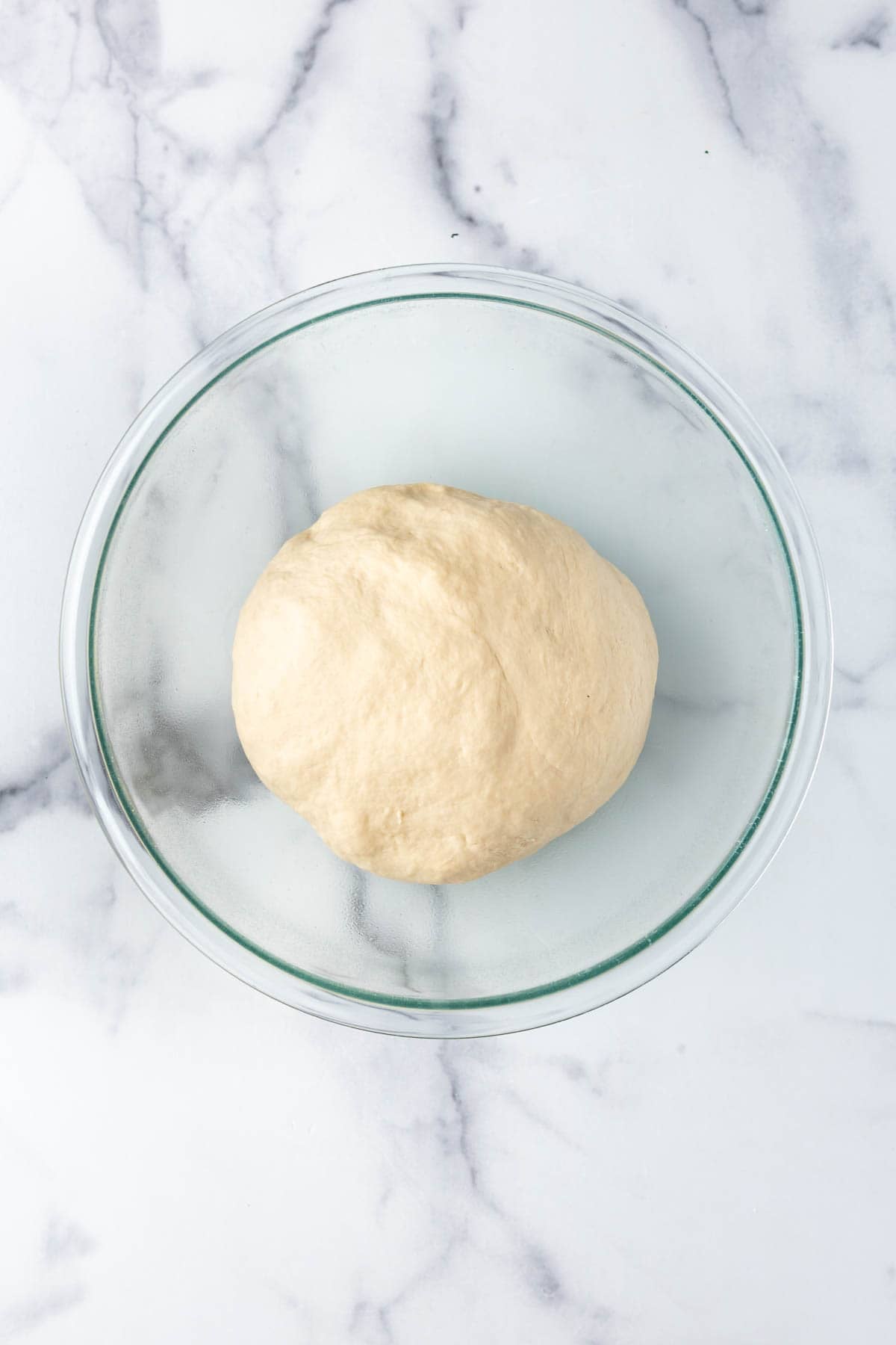 Sourdough sandwich bread dough in a bowl ready to proof.