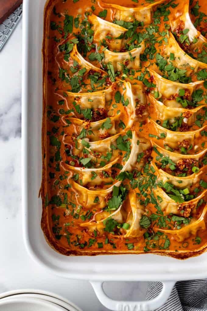 An overhead image of baked dumplings in a casserole dish.