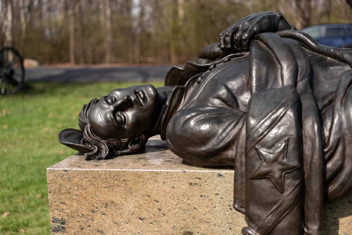 An image of a statue of a fallen confederate soldier at Gettysburg.