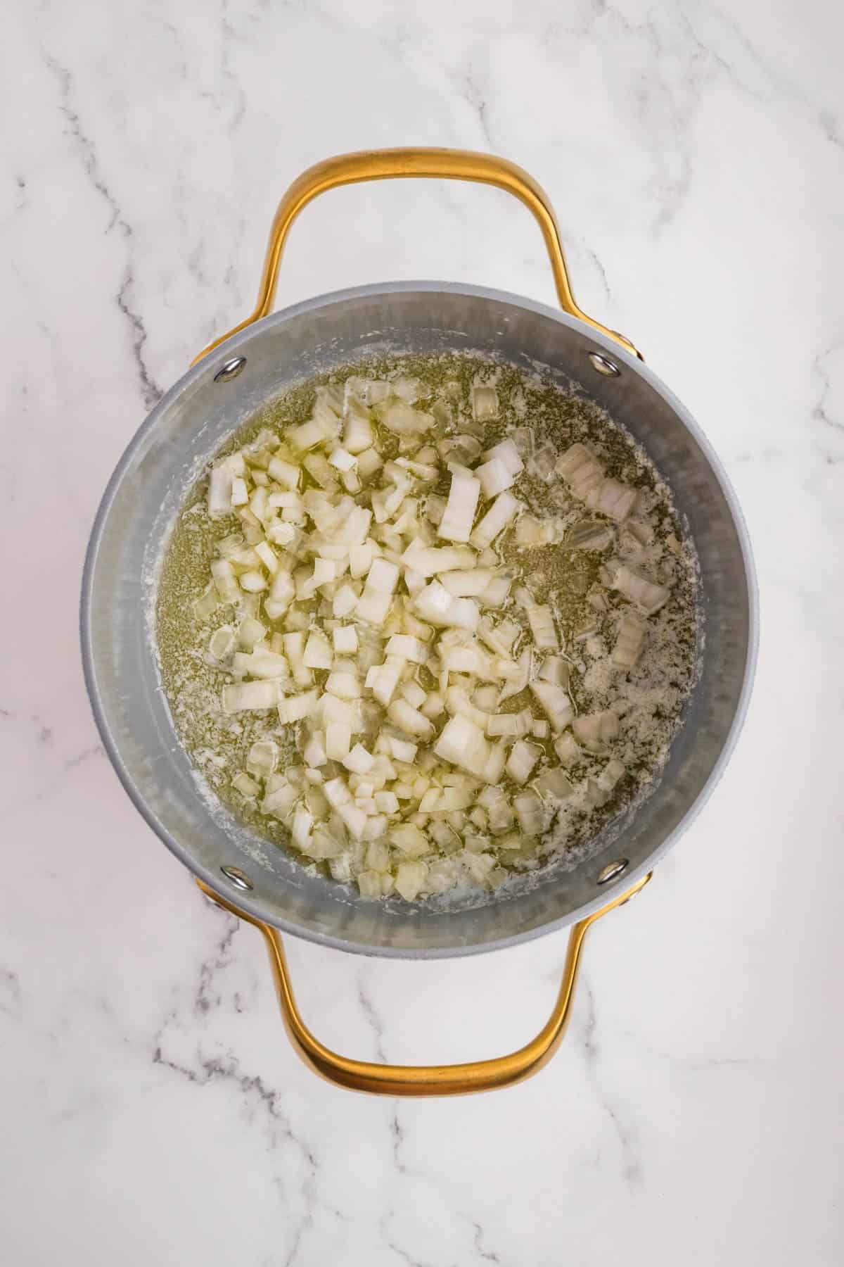 Sauteed onions in a pan.
