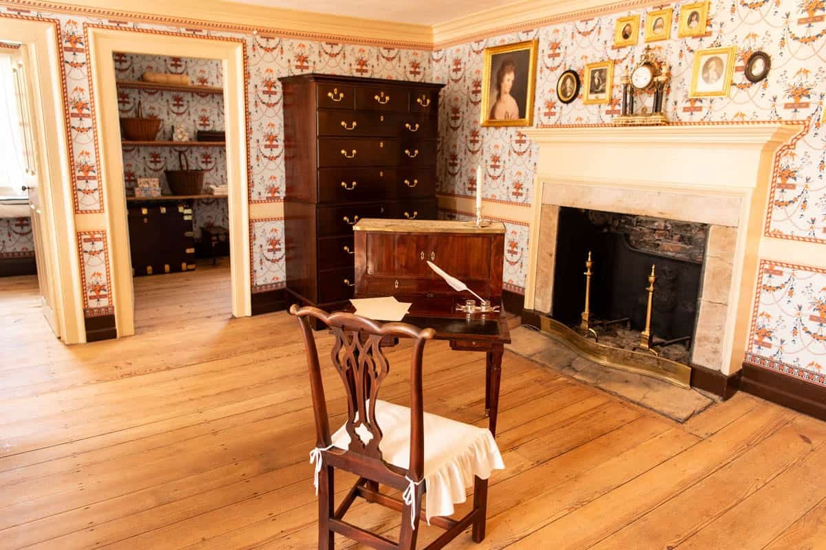 A chair in front of a fireplace at George Washington's home at Mount Vernon.