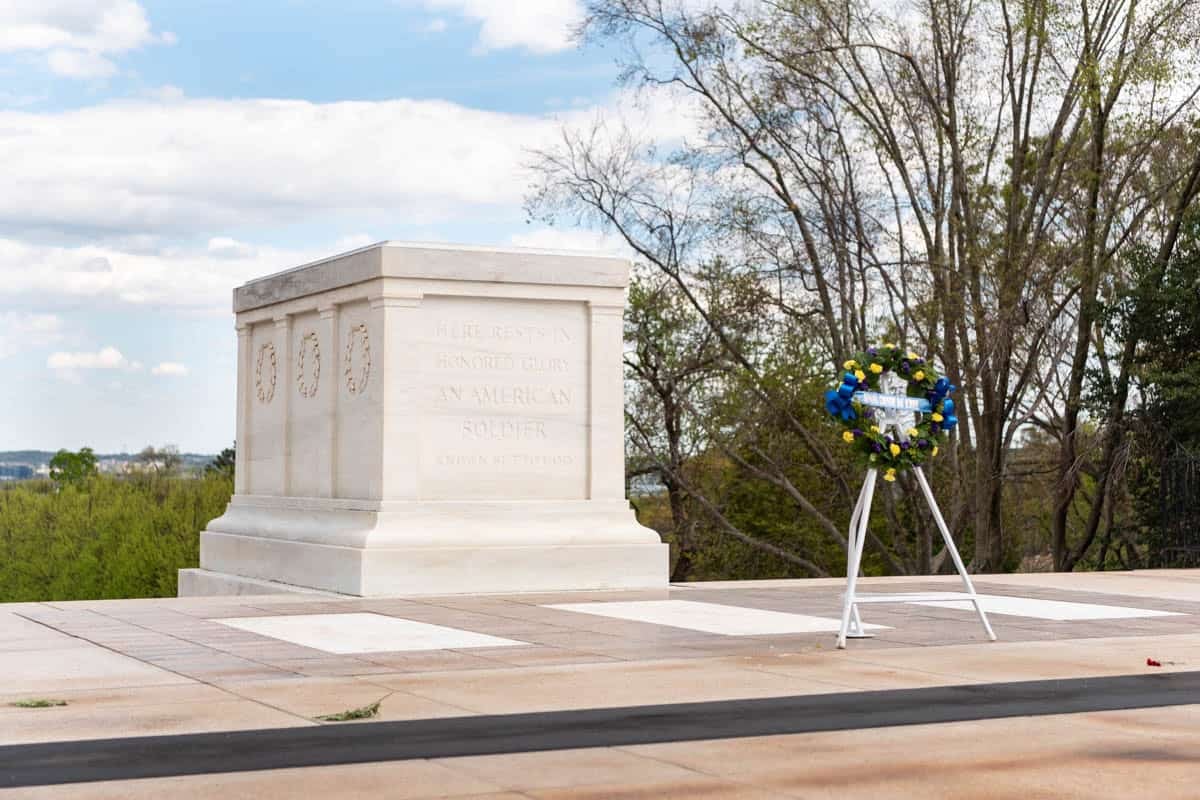 A wreath in front of the Tomb of the Unknown Soldier  in Arlington National Cemetery.